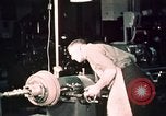 Image of buses in garage United States USA, 1937, second 59 stock footage video 65675051569