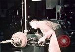 Image of buses in garage United States USA, 1937, second 60 stock footage video 65675051569