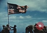 Image of famous American flag raising Mount Suribachi Iwo Jima, 1945, second 35 stock footage video 65675051573