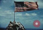 Image of famous American flag raising Mount Suribachi Iwo Jima, 1945, second 41 stock footage video 65675051573