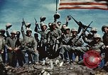 Image of famous American flag raising Mount Suribachi Iwo Jima, 1945, second 43 stock footage video 65675051573