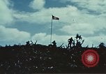 Image of famous American flag raising Mount Suribachi Iwo Jima, 1945, second 56 stock footage video 65675051573