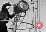 Image of LST communication using semaphore, signal flags, and blinking lights English Channel, 1944, second 10 stock footage video 65675051829