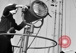 Image of LST communication using semaphore, signal flags, and blinking lights English Channel, 1944, second 11 stock footage video 65675051829