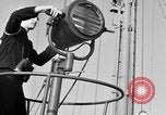 Image of LST communication using semaphore, signal flags, and blinking lights English Channel, 1944, second 12 stock footage video 65675051829