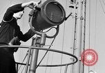 Image of LST communication using semaphore, signal flags, and blinking lights English Channel, 1944, second 13 stock footage video 65675051829