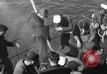 Image of U.S. sailors test fire hose on an LST Portland England United Kingdom, 1944, second 8 stock footage video 65675051842
