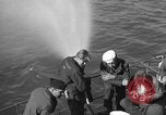 Image of U.S. sailors test fire hose on an LST Portland England United Kingdom, 1944, second 14 stock footage video 65675051842