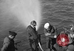 Image of U.S. sailors test fire hose on an LST Portland England United Kingdom, 1944, second 15 stock footage video 65675051842