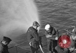 Image of U.S. sailors test fire hose on an LST Portland England United Kingdom, 1944, second 16 stock footage video 65675051842