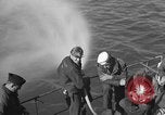 Image of U.S. sailors test fire hose on an LST Portland England United Kingdom, 1944, second 17 stock footage video 65675051842
