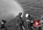 Image of U.S. sailors test fire hose on an LST Portland England United Kingdom, 1944, second 18 stock footage video 65675051842