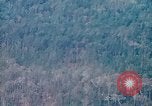 Image of smoky jungle Vietnam, 1967, second 3 stock footage video 65675051865