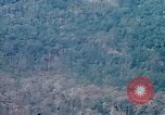 Image of smoky jungle Vietnam, 1967, second 4 stock footage video 65675051865