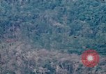 Image of smoky jungle Vietnam, 1967, second 6 stock footage video 65675051865