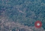 Image of smoky jungle Vietnam, 1967, second 7 stock footage video 65675051865