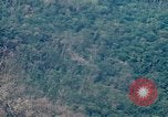 Image of smoky jungle Vietnam, 1967, second 8 stock footage video 65675051865