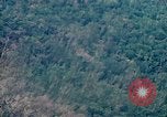 Image of smoky jungle Vietnam, 1967, second 9 stock footage video 65675051865
