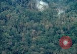 Image of smoky jungle Vietnam, 1967, second 16 stock footage video 65675051865