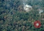 Image of smoky jungle Vietnam, 1967, second 19 stock footage video 65675051865