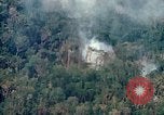 Image of smoky jungle Vietnam, 1967, second 20 stock footage video 65675051865