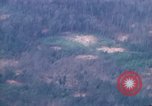 Image of smoky jungle Vietnam, 1967, second 52 stock footage video 65675051865