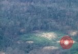 Image of smoky jungle Vietnam, 1967, second 58 stock footage video 65675051865