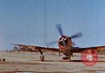 Image of Pilot examines flak damage to his P-47 aircraft Corsica France, 1944, second 5 stock footage video 65675051897