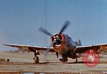 Image of Pilot examines flak damage to his P-47 aircraft Corsica France, 1944, second 6 stock footage video 65675051897