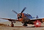 Image of Pilot examines flak damage to his P-47 aircraft Corsica France, 1944, second 7 stock footage video 65675051897
