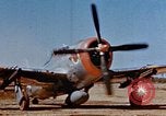 Image of Pilot examines flak damage to his P-47 aircraft Corsica France, 1944, second 9 stock footage video 65675051897