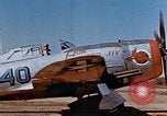Image of Pilot examines flak damage to his P-47 aircraft Corsica France, 1944, second 11 stock footage video 65675051897