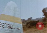 Image of Pilot examines flak damage to his P-47 aircraft Corsica France, 1944, second 16 stock footage video 65675051897