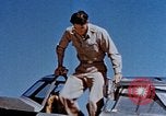 Image of Pilot examines flak damage to his P-47 aircraft Corsica France, 1944, second 17 stock footage video 65675051897