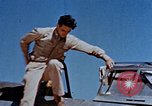 Image of Pilot examines flak damage to his P-47 aircraft Corsica France, 1944, second 18 stock footage video 65675051897