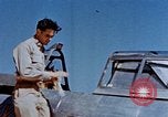 Image of Pilot examines flak damage to his P-47 aircraft Corsica France, 1944, second 19 stock footage video 65675051897
