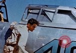 Image of Pilot examines flak damage to his P-47 aircraft Corsica France, 1944, second 20 stock footage video 65675051897