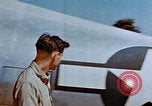 Image of Pilot examines flak damage to his P-47 aircraft Corsica France, 1944, second 22 stock footage video 65675051897