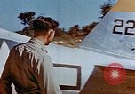 Image of Pilot examines flak damage to his P-47 aircraft Corsica France, 1944, second 23 stock footage video 65675051897