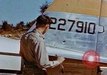 Image of Pilot examines flak damage to his P-47 aircraft Corsica France, 1944, second 24 stock footage video 65675051897