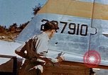 Image of Pilot examines flak damage to his P-47 aircraft Corsica France, 1944, second 25 stock footage video 65675051897