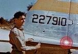 Image of Pilot examines flak damage to his P-47 aircraft Corsica France, 1944, second 26 stock footage video 65675051897