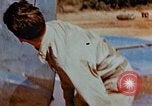 Image of Pilot examines flak damage to his P-47 aircraft Corsica France, 1944, second 28 stock footage video 65675051897