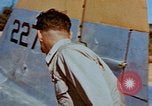 Image of Pilot examines flak damage to his P-47 aircraft Corsica France, 1944, second 31 stock footage video 65675051897
