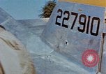 Image of Pilot examines flak damage to his P-47 aircraft Corsica France, 1944, second 32 stock footage video 65675051897