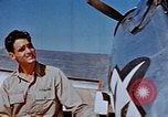Image of Pilot examines flak damage to his P-47 aircraft Corsica France, 1944, second 39 stock footage video 65675051897