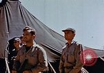 Image of Pilot examines flak damage to his P-47 aircraft Corsica France, 1944, second 41 stock footage video 65675051897
