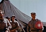 Image of Pilot examines flak damage to his P-47 aircraft Corsica France, 1944, second 42 stock footage video 65675051897