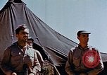 Image of Pilot examines flak damage to his P-47 aircraft Corsica France, 1944, second 43 stock footage video 65675051897