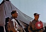 Image of Pilot examines flak damage to his P-47 aircraft Corsica France, 1944, second 44 stock footage video 65675051897